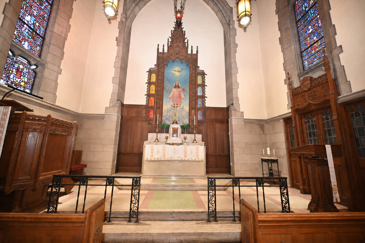 Interior of the Pro-Cathedral with altar, candles, and stained glass of Saint George